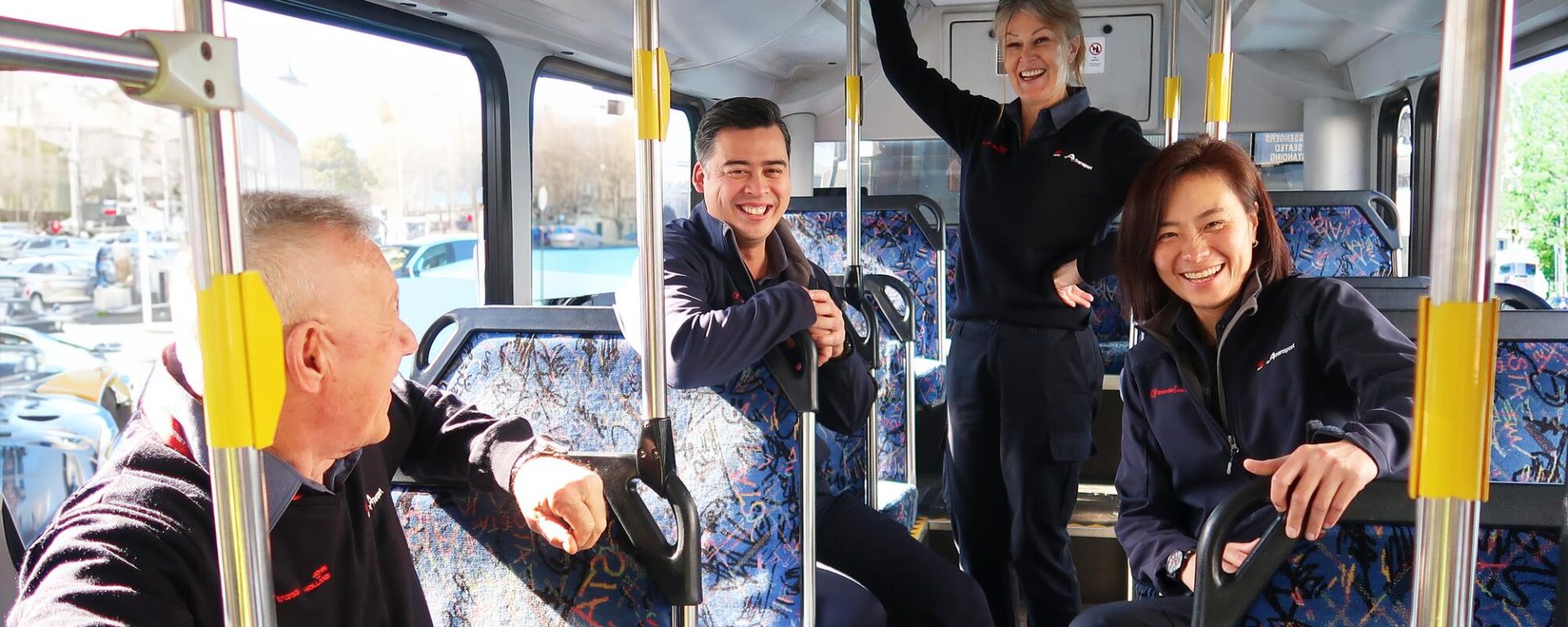 Transdev Australia gender equality with men and women staff in a bus